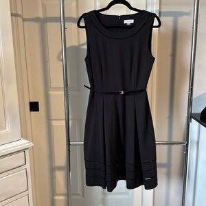 Calvin Klein black, sleeveless, knee-length dress.